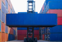 Forklift and container, image via Shutterstock