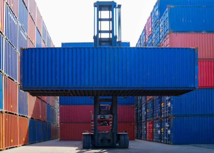 Forklift and container, image via Shutterstock